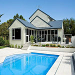 House that Joe lancaster & son LTD built with outdoor area and a pool.
